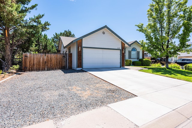 1419 Purple Sage Dr, Gardnerville, NV 89460 - single story home with driveway, an attached garage, and a gate