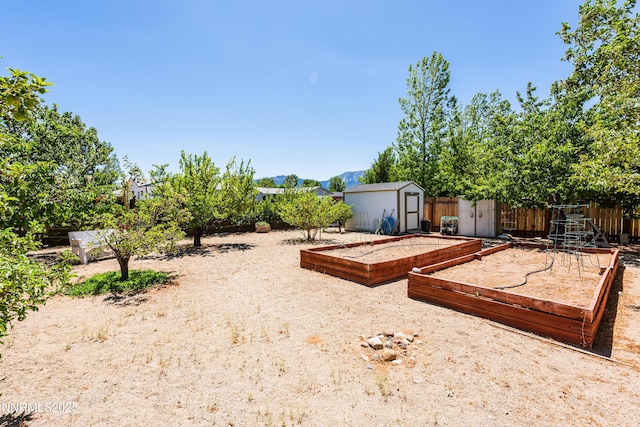 1419 Purple Sage Dr, Gardnerville, NV 89460 - view of yard with a storage unit and a vegetable garden
