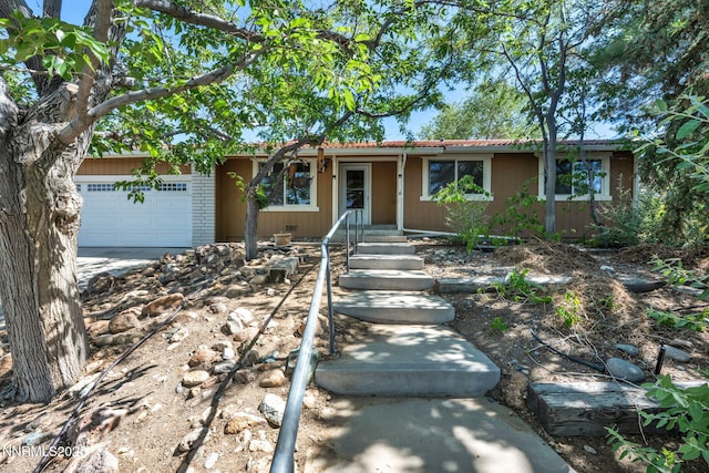 1425 Julie Ct, Reno, NV 89509 - ranch-style house featuring a garage