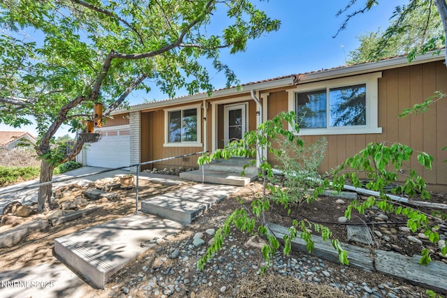 1425 Julie Ct, Reno, NV 89509 - ranch-style house with a garage and concrete driveway
