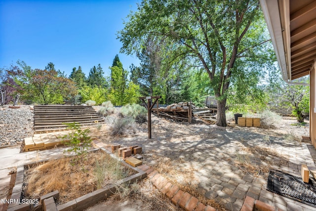 1425 Julie Ct, Reno, NV 89509 - view of yard featuring a patio area and view of wooded area