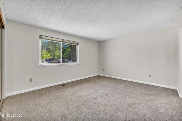 1425 Julie Ct, Reno, NV 89509 - carpeted empty room with a textured ceiling and baseboards