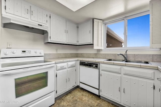 1425 Julie Ct, Reno, NV 89509 - kitchen with white appliances, under cabinet range hood, and white cabinetry