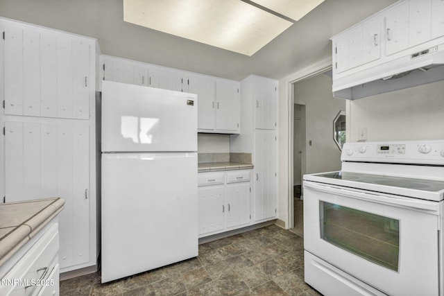 1425 Julie Ct, Reno, NV 89509 - kitchen featuring white appliances, white cabinets, stone finish floors, and under cabinet range hood