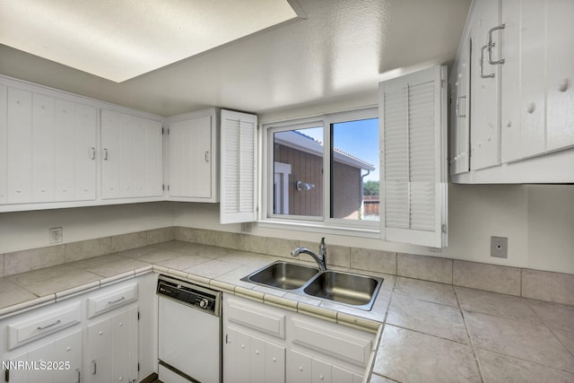1425 Julie Ct, Reno, NV 89509 - kitchen with white dishwasher, white cabinets, and light countertops