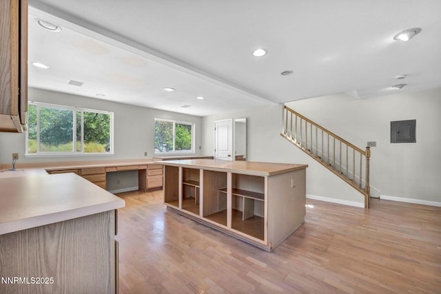 1425 Julie Ct, Reno, NV 89509 - kitchen featuring open shelves, light wood-type flooring, light countertops, electric panel, and recessed lighting