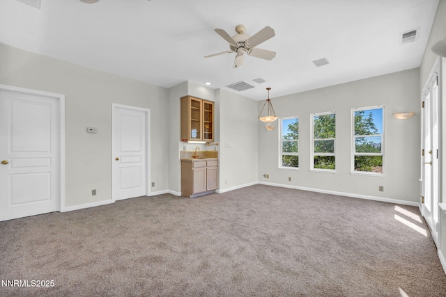 1425 Julie Ct, Reno, NV 89509 - unfurnished living room featuring ceiling fan and carpet floors