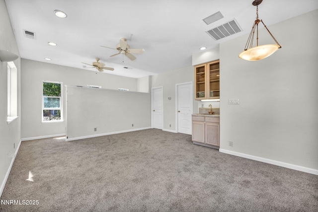 1425 Julie Ct, Reno, NV 89509 - unfurnished living room featuring carpet floors, ceiling fan, recessed lighting, and bar with sink