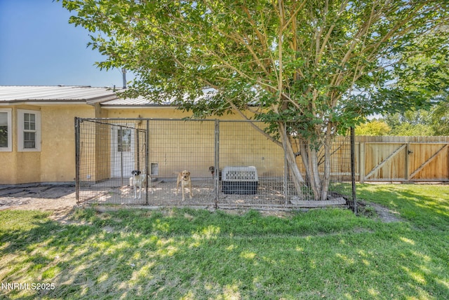 4210 Magnolia Rd, Fallon, NV 89406 - back of property with stucco siding, a metal roof, and an outdoor structure