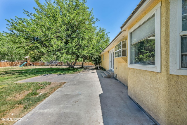 4210 Magnolia Rd, Fallon, NV 89406 - fenced backyard with a patio and a playground