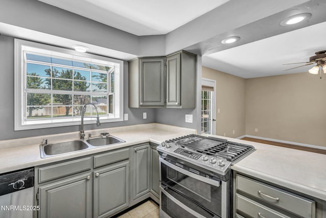 4210 Magnolia Rd, Fallon, NV 89406 - kitchen with stainless steel appliances, gray cabinets, a ceiling fan, light countertops, and recessed lighting