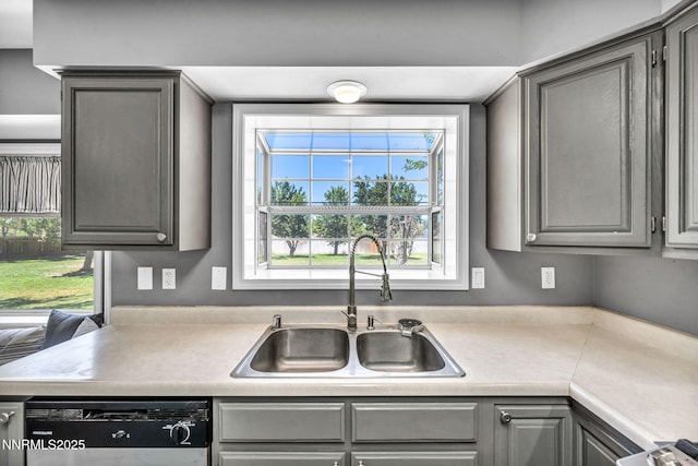4210 Magnolia Rd, Fallon, NV 89406 - kitchen featuring gray cabinets, dishwashing machine, and light countertops