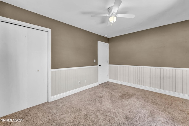 4210 Magnolia Rd, Fallon, NV 89406 - unfurnished bedroom with carpet flooring, a wainscoted wall, a closet, and ceiling fan