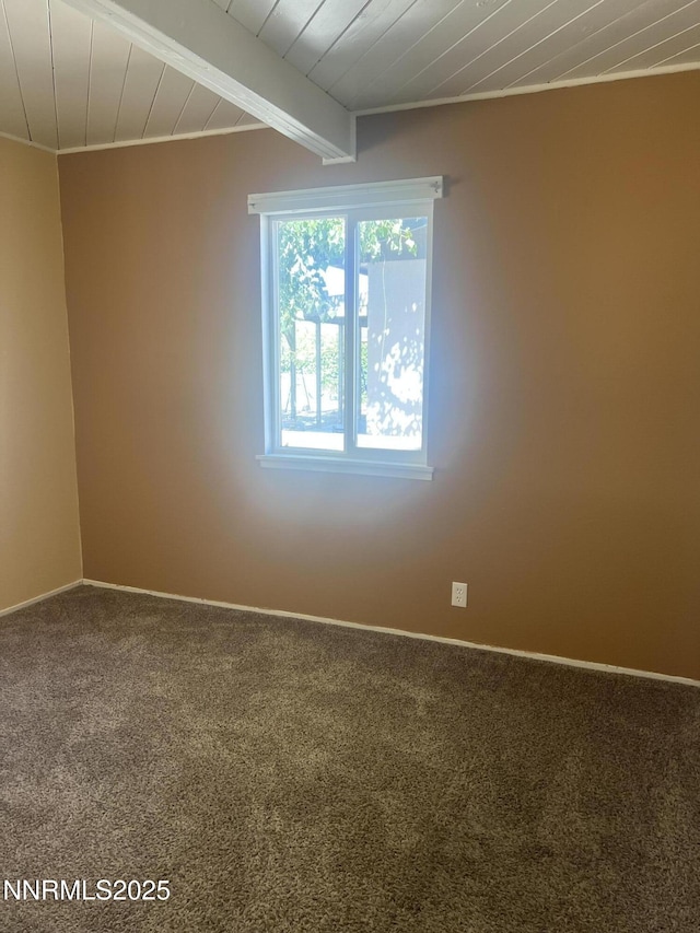 385 Smithridge Park Unit 3Ut4Lt, Reno, NV 89502 - empty room with carpet flooring and a wooden ceiling with exposed beams