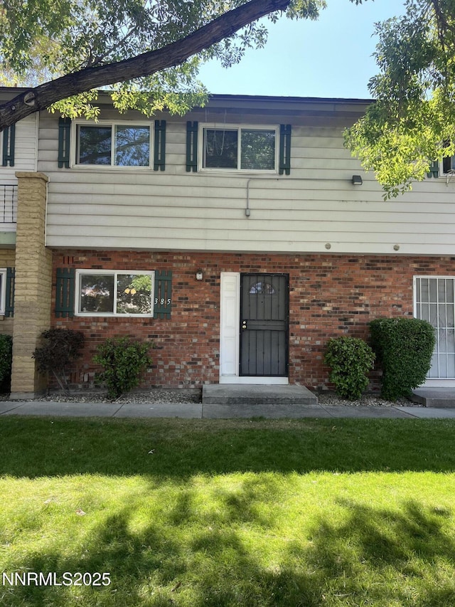 385 Smithridge Park Unit 3Ut4Lt, Reno, NV 89502 - view of property featuring a front yard and brick siding