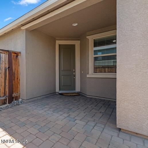 1460 Waterloo Dr, Reno, NV 89509 - property entrance featuring stucco siding and a patio
