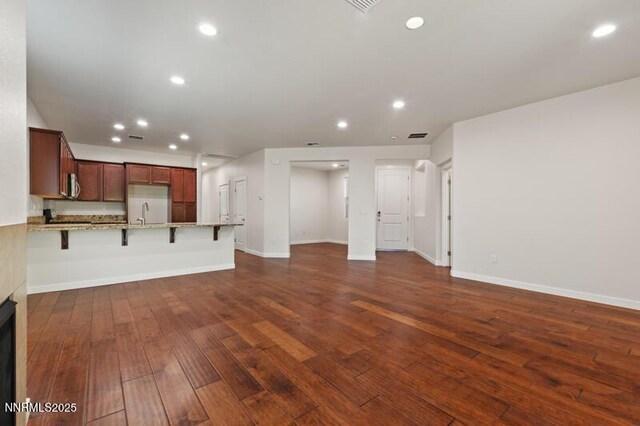 1460 Waterloo Dr, Reno, NV 89509 - unfurnished living room featuring dark wood-type flooring and recessed lighting
