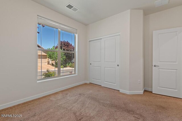1460 Waterloo Dr, Reno, NV 89509 - unfurnished bedroom with carpet floors and a closet