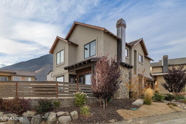 2912 Portrush Dr, Genoa, NV 89411 - back of house featuring a chimney and stucco siding