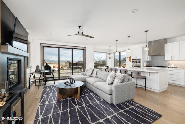 2912 Portrush Dr, Genoa, NV 89411 - living room featuring a ceiling fan and light wood-style floors