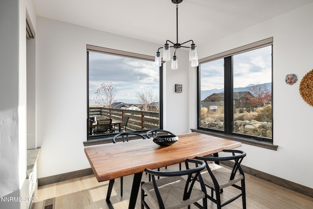 2912 Portrush Dr, Genoa, NV 89411 - dining space with a chandelier and wood finished floors