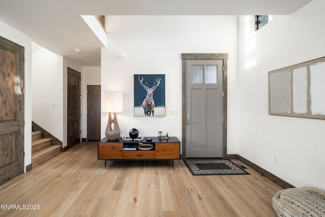 2912 Portrush Dr, Genoa, NV 89411 - entrance foyer with light wood-type flooring and stairway
