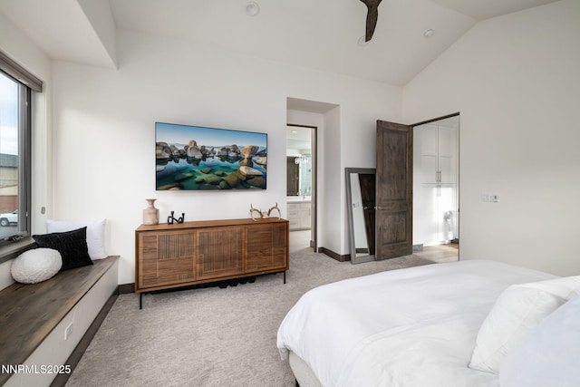 2912 Portrush Dr, Genoa, NV 89411 - bedroom featuring light carpet, vaulted ceiling, and ensuite bath