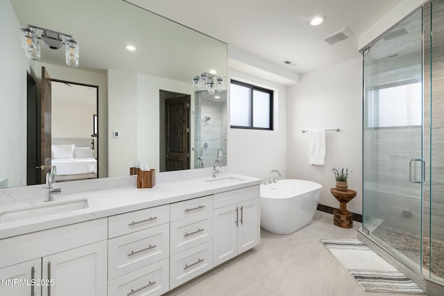 2912 Portrush Dr, Genoa, NV 89411 - bathroom featuring a shower stall, a freestanding bath, double vanity, and recessed lighting