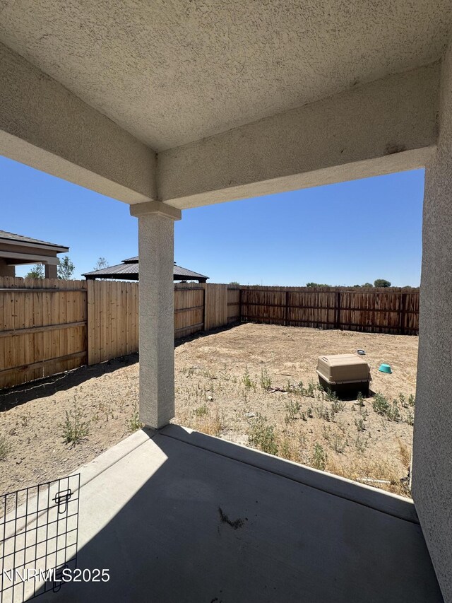 427 Agate Ln, Fallon, NV 89406 - fenced backyard with a patio area