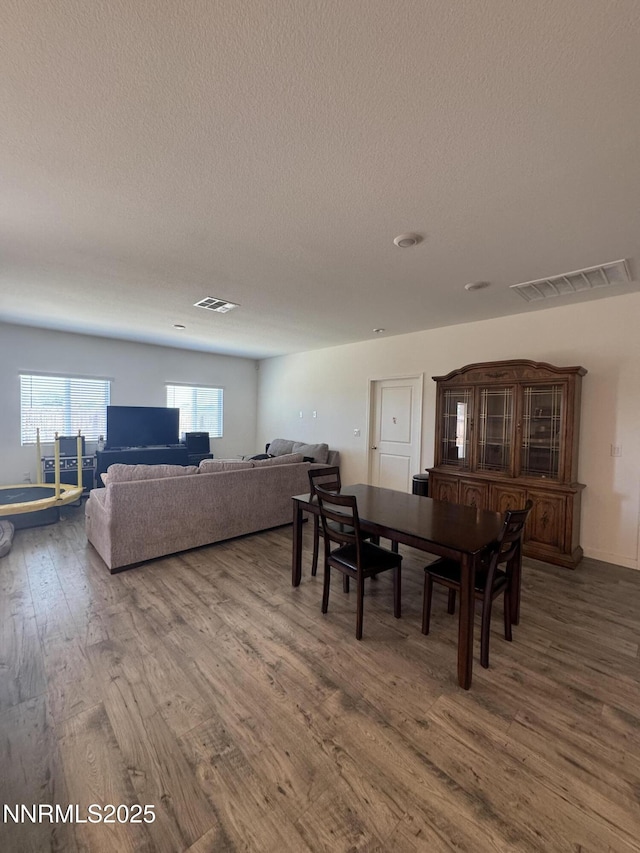 427 Agate Ln, Fallon, NV 89406 - dining space with wood finished floors and a textured ceiling