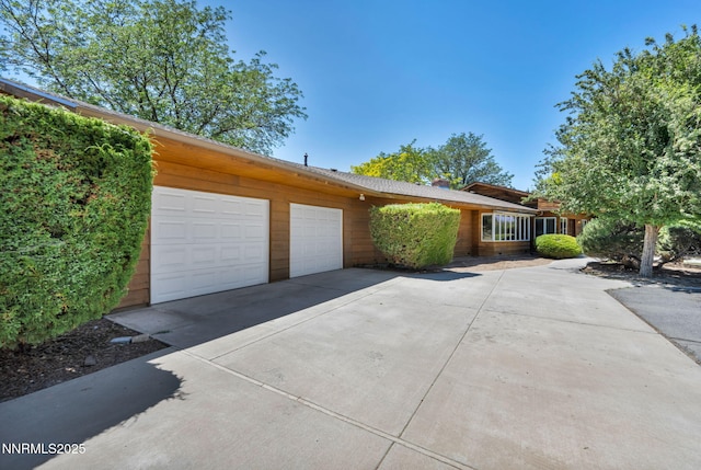 1405 Primrose Ln, Minden, NV 89423 - ranch-style house with driveway and a garage