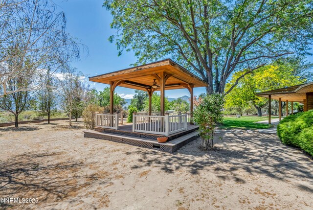 1405 Primrose Ln, Minden, NV 89423 - view of yard with a gazebo, a deck with mountain view, and ceiling fan