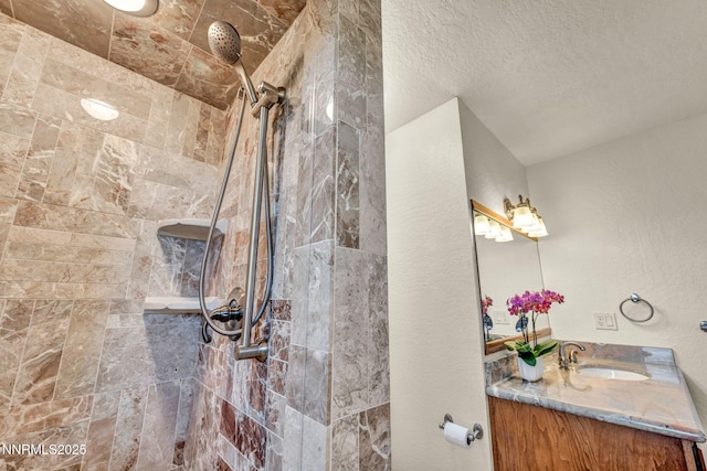 1405 Primrose Ln, Minden, NV 89423 - bathroom with vanity, tiled shower, and a textured ceiling