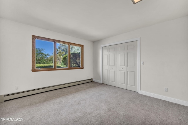 1405 Primrose Ln, Minden, NV 89423 - unfurnished bedroom featuring baseboard heating, carpet, and a closet