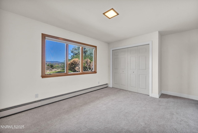 1405 Primrose Ln, Minden, NV 89423 - unfurnished bedroom with baseboard heating, carpet flooring, and a closet