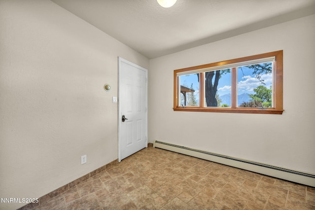 1405 Primrose Ln, Minden, NV 89423 - empty room with a baseboard radiator and stone finish flooring