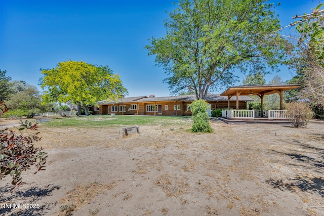 1405 Primrose Ln, Minden, NV 89423 - rear view of property with covered porch