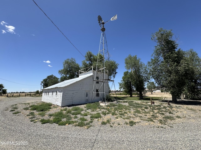 7650 Grass Valley Rd, Winnemucca, NV 89445 - view of side of property featuring a barn and an outdoor structure
