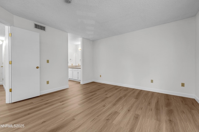 2875 Idlewild Dr Apt 5, Reno, NV 89509 - unfurnished room with light wood-style flooring and a textured ceiling
