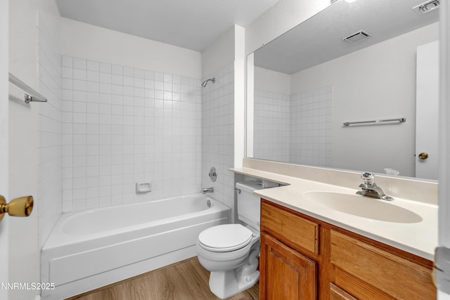 2875 Idlewild Dr Apt 5, Reno, NV 89509 - bathroom featuring wood finished floors, vanity, and tub / shower combination