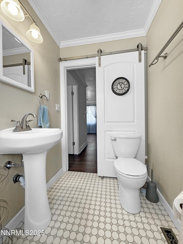 540 Garrison St, Winnemucca, NV 89445 - bathroom featuring toilet and crown molding