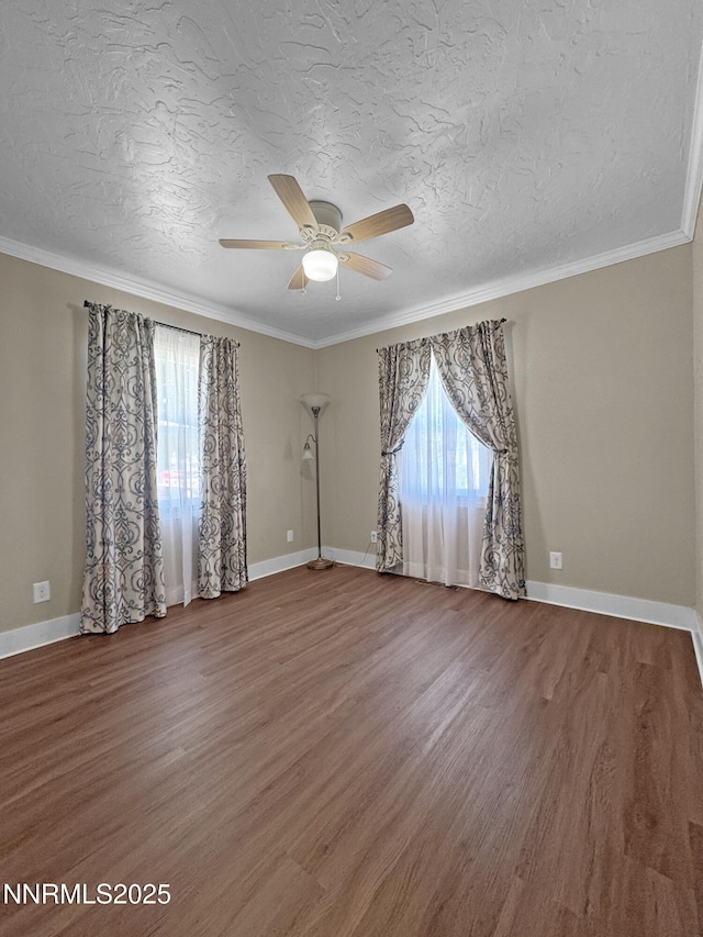 540 Garrison St, Winnemucca, NV 89445 - spare room featuring healthy amount of natural light, ceiling fan, wood finished floors, a textured ceiling, and crown molding