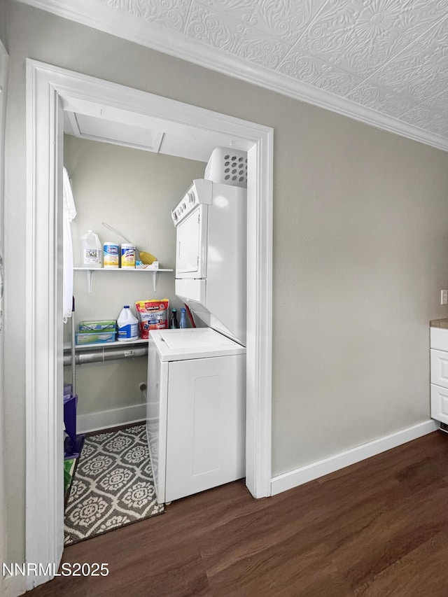 540 Garrison St, Winnemucca, NV 89445 - washroom featuring stacked washer / drying machine, dark wood-type flooring, and ornamental molding