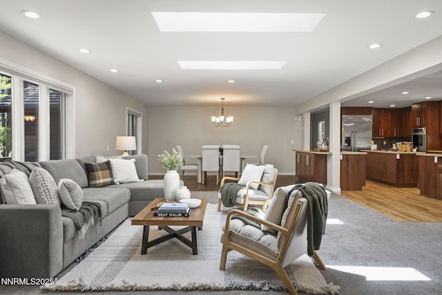 1705 Blue Spruce Rd, Reno, NV 89511 - living room with recessed lighting, a chandelier, a skylight, and light carpet