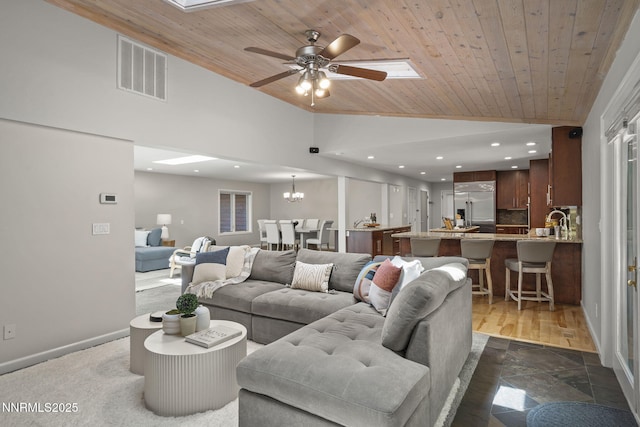1705 Blue Spruce Rd, Reno, NV 89511 - living room with a skylight, vaulted ceiling, recessed lighting, wooden ceiling, and a ceiling fan