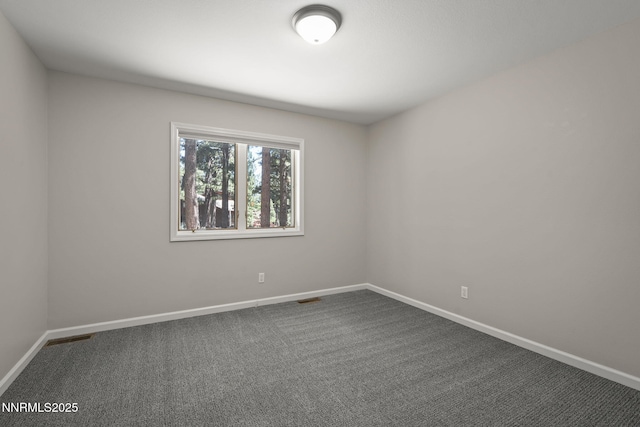 1705 Blue Spruce Rd, Reno, NV 89511 - empty room with dark carpet and baseboards