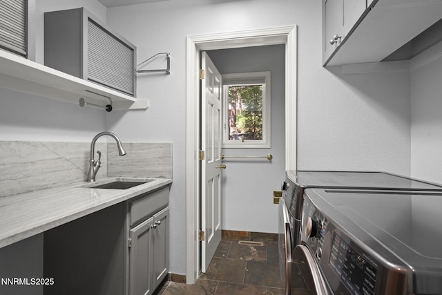 1705 Blue Spruce Rd, Reno, NV 89511 - washroom with cabinet space, stone tile floors, and washer and clothes dryer