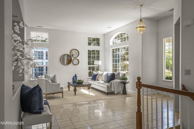 4811 Elkcreek Trl, Reno, NV 89519 - tiled living area featuring baseboards and a chandelier