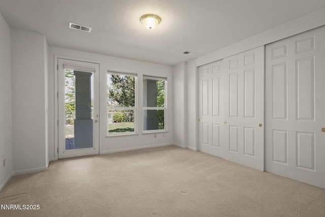 4811 Elkcreek Trl, Reno, NV 89519 - unfurnished bedroom with carpet, multiple windows, and access to exterior