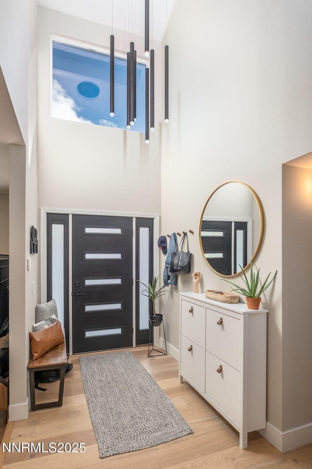 3390 Thornhill Dr, Reno, NV 89509 - entryway with a high ceiling and light wood-style floors